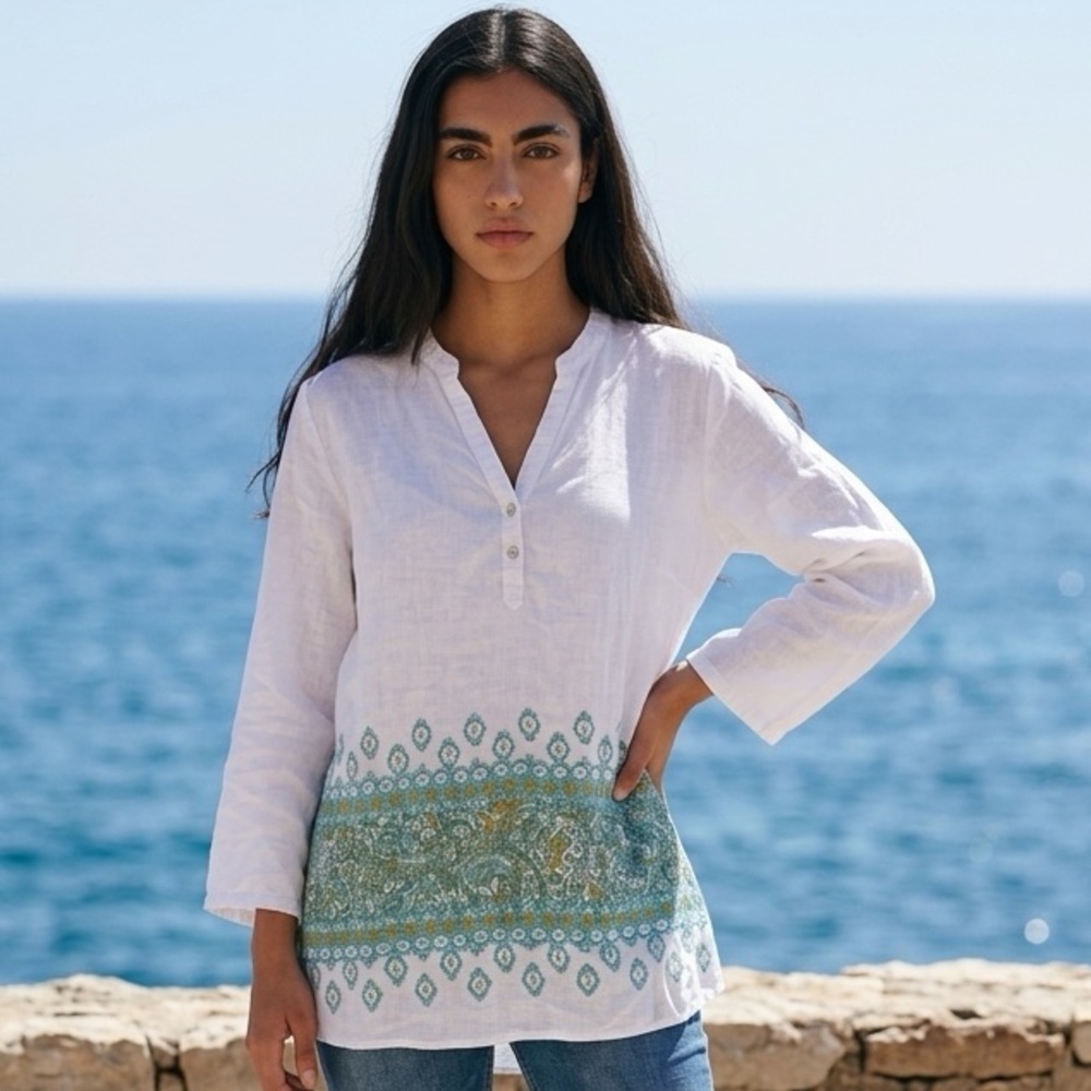 white Cynthia Rowley linen tunic blouse featuring a V-neckline and long sleeves